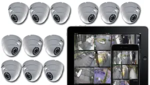 Dome security cameras with live footage on a tablet and phone
